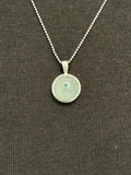 Moonstone with emerald