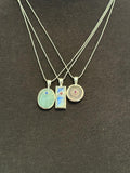 Moonstone with emerald